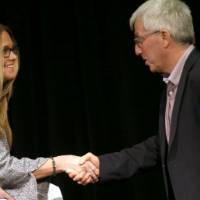 Lisa Perhamus shakes hands with Jeff Kelly Lowenstein, the fourth endowed professor of civil discourse